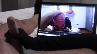 Gift to my giant fan: tugjob in gloves, whilst is watching one of my movie scenes, with spunk fountain