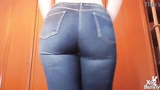 Large overweight consummate booty walking in blue jeans and showing it off