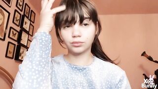 Brunette hair with natural large lips with natural color lipgloss smokin' a cigarette blowing smoke in your face