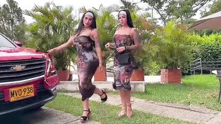 two LADIES WALK AND MOVING THEIR ASS CHEEKS IN A PARK