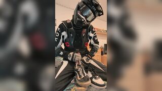 Homosexual motocross rider jerks off and cums on his trainers