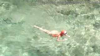 Yellow swimming trunks and blue water