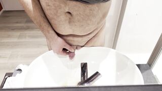 Large plump bear with tiny dick peeing in hotel sink in the morning