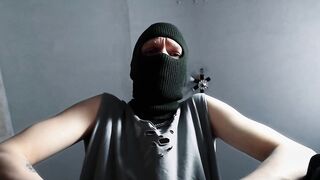 Feet fastened constricted underneath coarse military boots