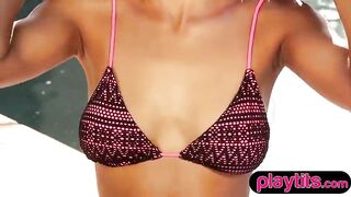 Breasty skinny breathtaking ebony cutie disrobes outdoors by the pool to flaunt hot figure