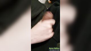 Taut-fisted strokes on a veiny erection, precum glistening at the tip.