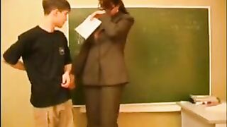 Slutty teacher is using an opportunity to bang one of her students, during the time that no one is watching