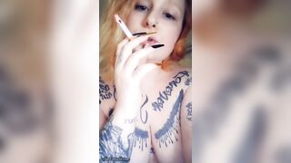 Redhead looks at u during the time that smokin' a cigar