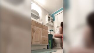 Teen gal sitting on crapper