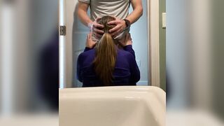 On her knees getting face banged