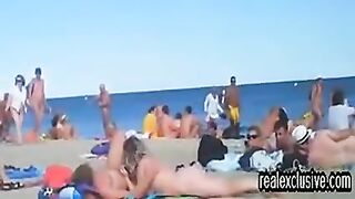 Concupiscent voyeur is watching, during the time that lascivious couples are having sex on the public exposed beach