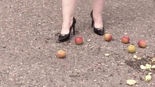 Crush fetish outdoors Plump legs in high heel shoes crush apples