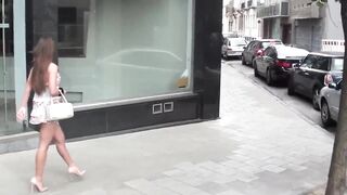 cute french floozy with eyeglass shows her twat in street