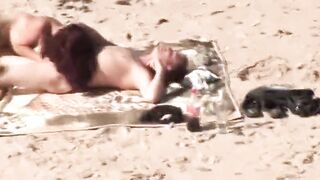 Slutty pair is having steamy sex on a nudist beach and enjoying each second of it