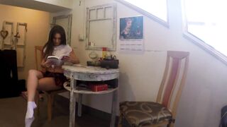 Hawt and Sexy Lewd Hotty in a very Short Petticoat out of any Underclothes reads a Book and touches Herself