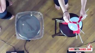 4 beauties play a game of disrobe pop the balloon