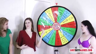 three very marvelous angels play a game of disrobe spin the wheel