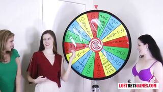 three very marvelous angels play a game of disrobe spin the wheel
