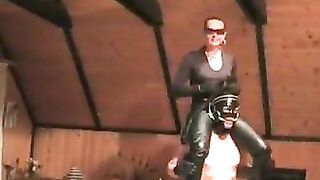Mistresse rides on the shoulders,in leather panties