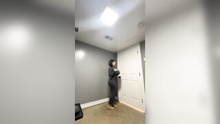 Sexy trans CD in constricted gray costume teasing massive schlong
