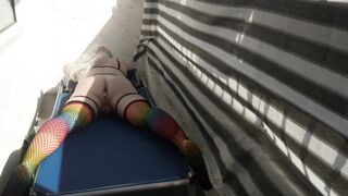 Caged sissy plays with her sextoy on public balcony