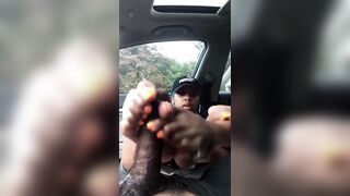 Sexy black floozy footjob to ebony rod in car